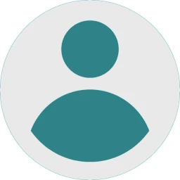 T&uuml;rkisfarbiges schematisches Personen-Symbol in einem grauen Kreis mit wei&szlig;em Hintergrund. Das Symbol besteht aus einem Kreis, der einen Kopf darstellt, und einem halbkreisf&ouml;rmigen Bereich darunter, der als Oberk&ouml;rper interpretiert werden kann.
