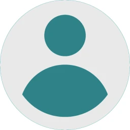 Ein t&uuml;rkisfarbenes Symbol bestehend aus einem Kreis oben und einem halbkreisf&ouml;rmigen Element unten, das gemeinsam eine stilisierte Person darstellt. Der Hintergrund ist wei&szlig; und kreisf&ouml;rmig umrandet.